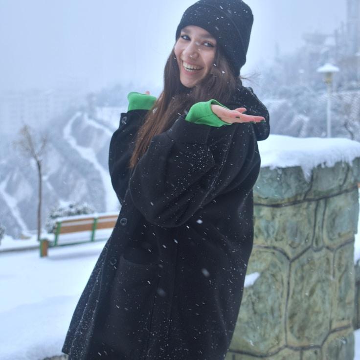 Kaveri Mehta, Lead Design Curator at SilverFieldStudio, reviewing corporate floral arrangements